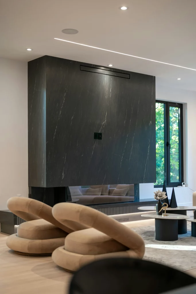 Dark marble slab fireplace wall