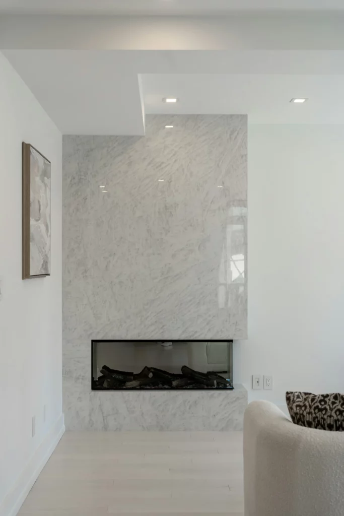 White marble fireplace surround in a living room