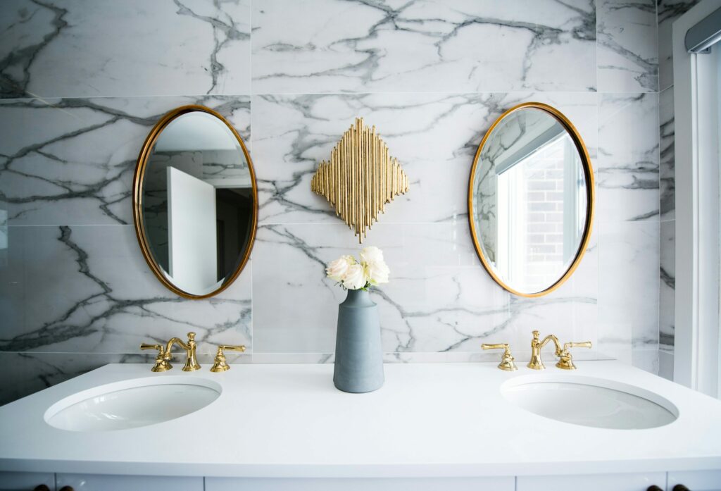 Double vanity with marble walls and two sinks