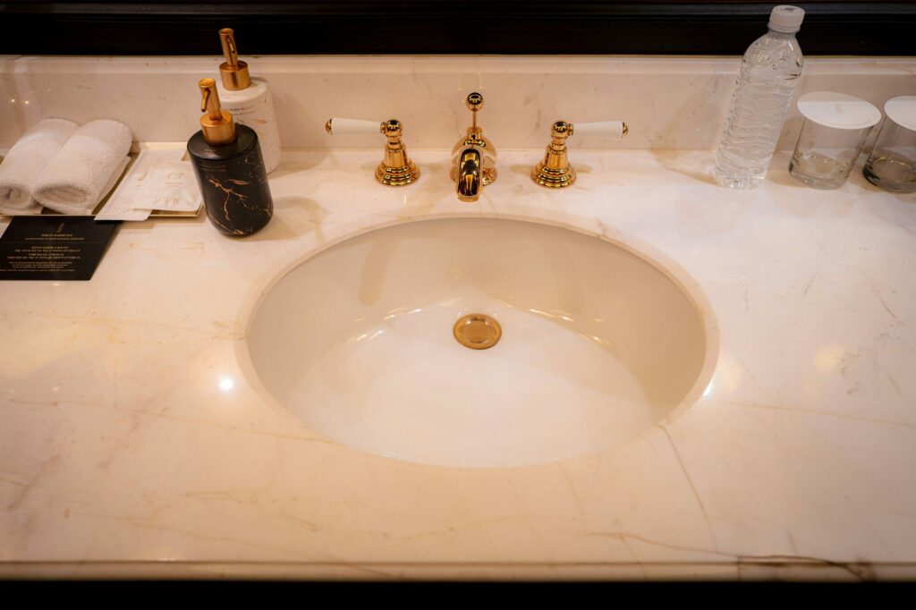 Marble vanity top with brass fixtures